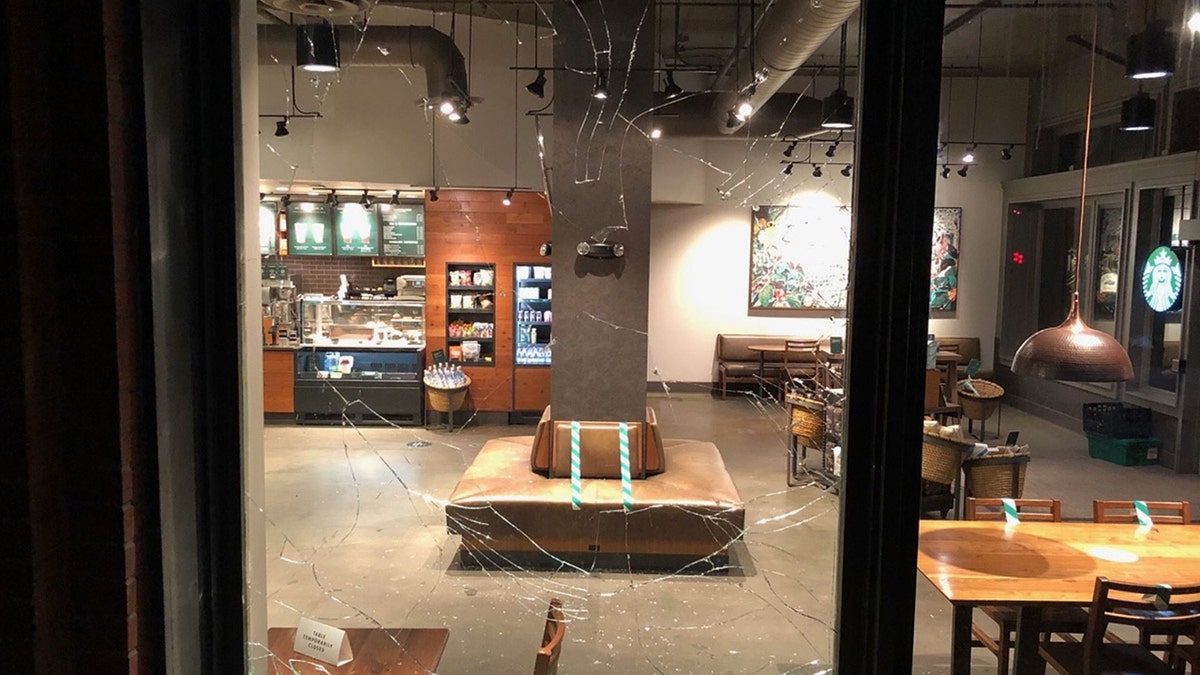 Rioters smashed the window of a Starbucks in Portland Friday night.