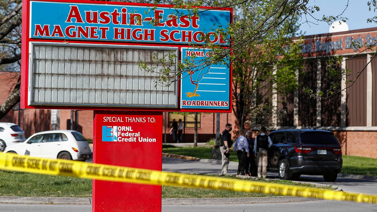 Knoxville police work the scene of a shooting at Austin-East Magnet High School Monday, April 12, 2021, in Knoxville, Tenn. (AP Photo/Wade Payne)