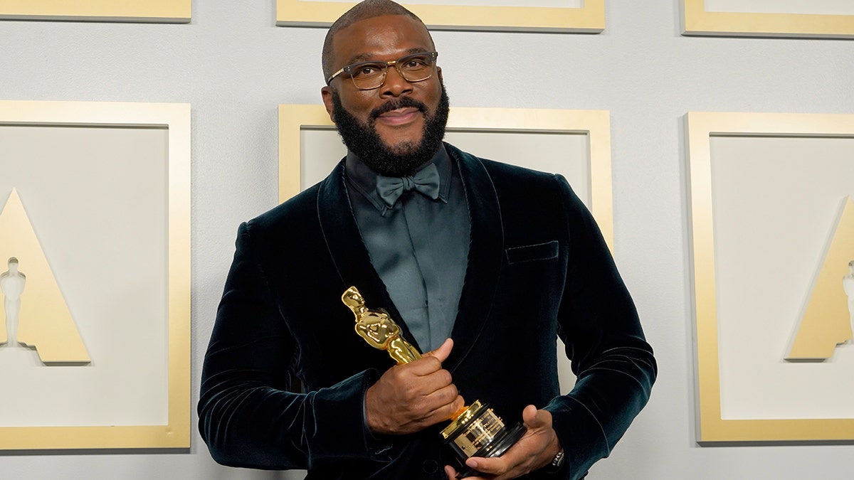 Tyler Perry, winner of the Jean Hersholt Humanitarian Award, poses in the press room at the Oscars on Sunday, April 25, 2021, at Union Station in Los Angeles.