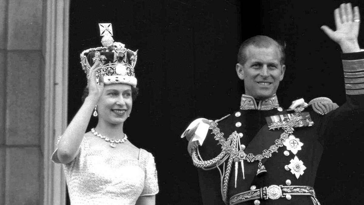 In this June 2, 1953 file photo, Britain's Queen Elizabeth II and her husband, the Duke of Edinburgh, wave from the balcony of Buckingham Palace, London, following the Queen's coronation at Westminster Abbey. Buckingham Palace confirmed Philip's death at the age of 99 last Friday. 