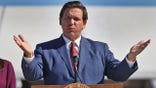 MIAMI GARDENS, FLORIDA - JANUARY 06: Florida Governor Ron DeSantis speaks during a press conference about the opening of a COVID-19 vaccination site at the Hard Rock Stadium on January 06, 2021 in Miami Gardens, Florida. The governor announced that the stadium's parking lot which offers COVID-19 tests will begin to offer COVID-19 vaccinations for residents 65 and older to drive up and get vaccinated. The vaccination site opened today for a trial run but it was not known when it will be open to the general public. (Photo by Joe Raedle/Getty Images)