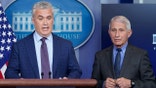White House COVID-19 Response Coordinator Jeff Zients, left, speaks alongside Dr. Anthony Fauci, director of the National Institute of Allergy and Infectious Diseases, during a press briefing at the White House, Tuesday, April 13, 2021, in Washington. (AP Photo/Patrick Semansky)
