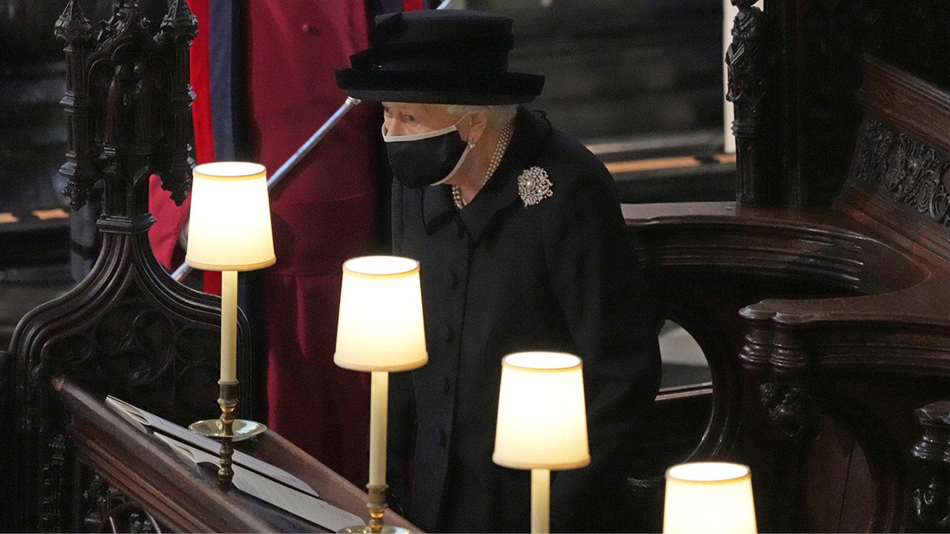 Queen Elizabeth II takes her seat inside St. George's Chapel at Windsor Castle for the funeral of her husband Prince Philip. Picture date: Saturday April 17, 2021. PA Photo. See PA story FUNERAL Philip. Photo credit should read: Yui Mok/PA Wire