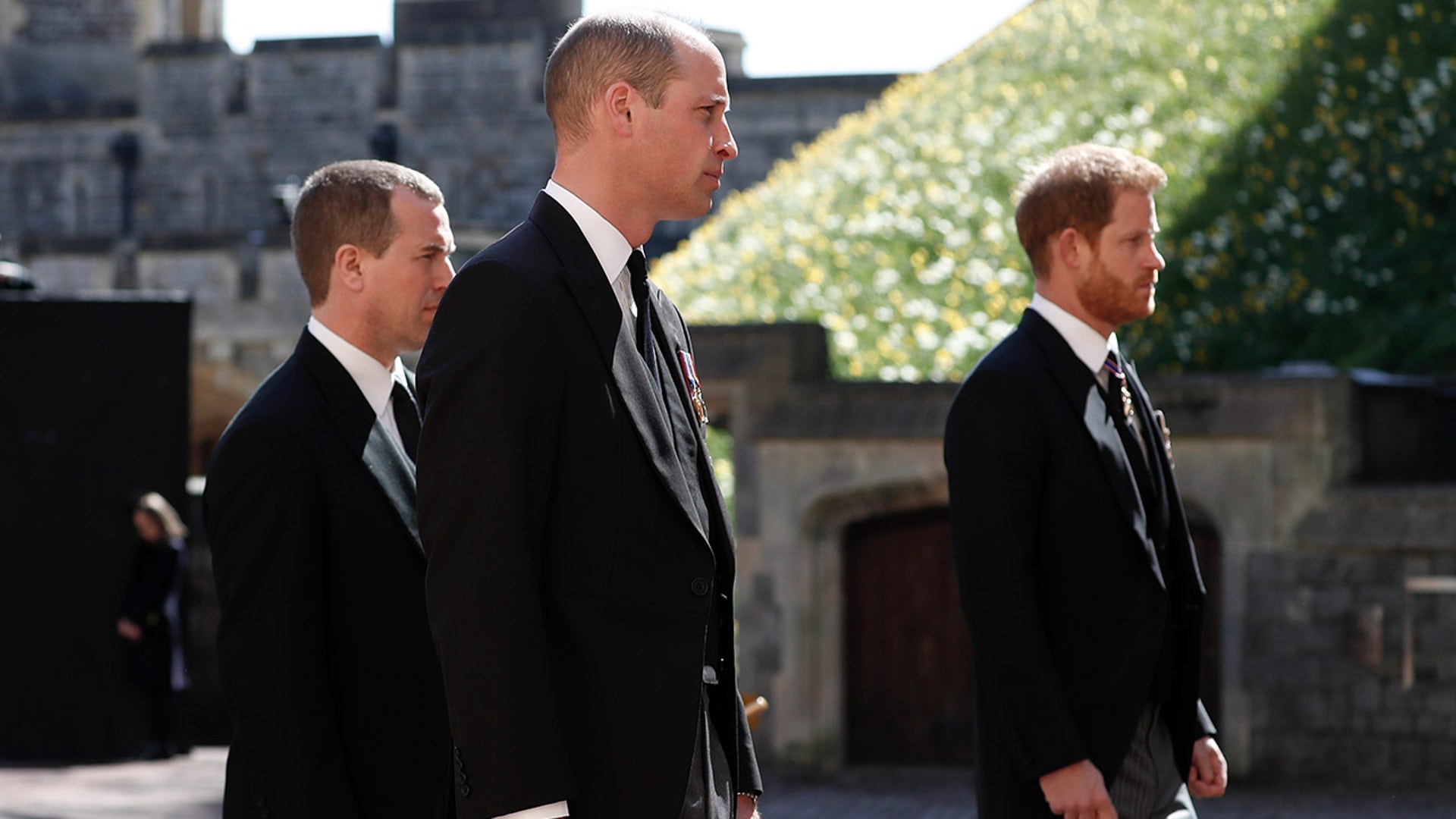 Prince Harry, right, Prince William, Peter Phillips, left, follow the coffin in a ceremonial procession for the funeral of Prince Philip at Windsor Castle in Windsor, England on Saturday. Philip died April 9 at the age of 99 after 73 years of marriage to Queen Elizabeth II. (Alastair Grant/Pool via AP)