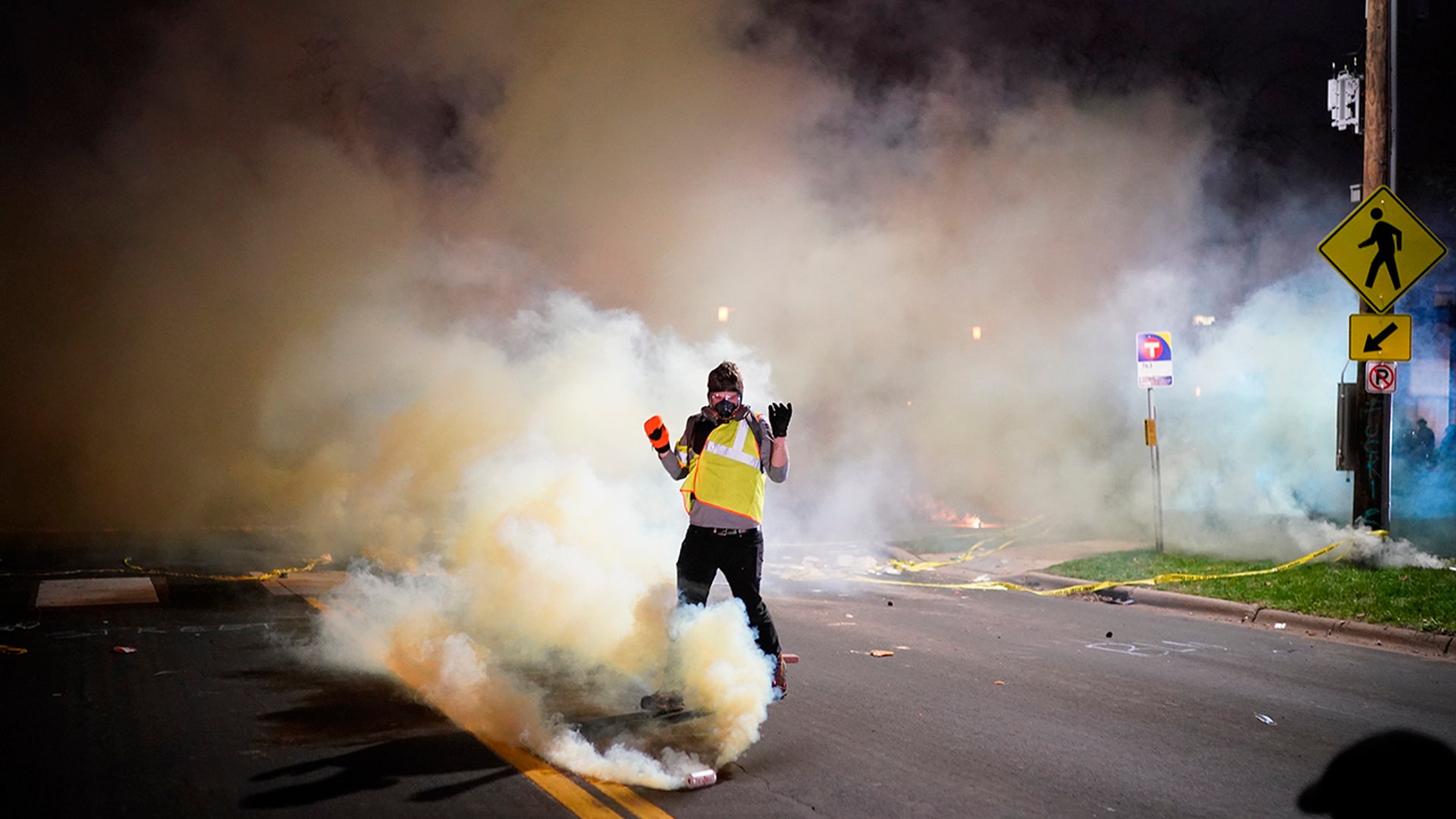 Police fire dispersants into a crowd of protesters outside the Brooklyn Center Police Department, late Sunday, April 11, 2021, in Brooklyn Center, Minnesota. The family of Daunte Wright, 20, told a crowd that he was shot by police Sunday before getting back into his car and driving away, then crashing the vehicle several blocks away. The family said Wright was later pronounced dead.