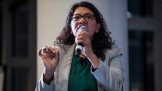 Rashida Tlaib says she's only wearing a mask because of a 'Republican tracker' near her