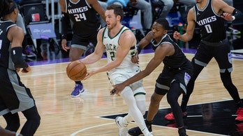 Bucks slip past Kings 129-128 without Antetokounmpo