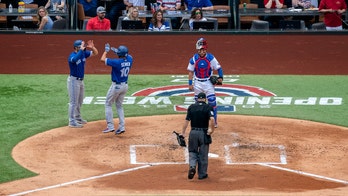 Blue Jays spoil Rangers home opener before largest MLB crowd