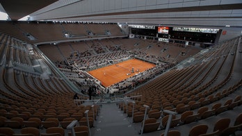 Top-ranked Djokovic loses, No. 3 Nadal eases into quarters