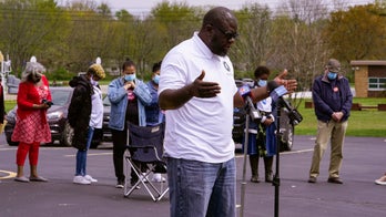 ‘It hurts us all’: Vigil held for employees slain during FedEx shooting