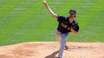 Bieber sets K record, fans 13 as Indians beat Reds 6-3