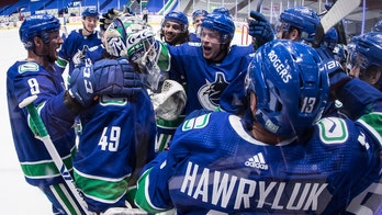 Canucks top Leafs 3-2 in OT in return from COVID layoff