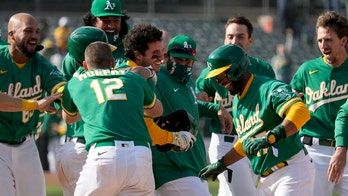 A's extend winning streak to 11, helped by 2 errors in 10th