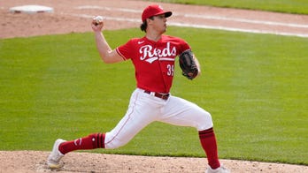 Reds fan loses nachos and shoe trying to catch homer for son, pitcher Lucas Sims sends him signed ball after