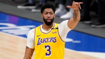 LA star Davis returns as Mavs lose Porzingis in 115-110 win