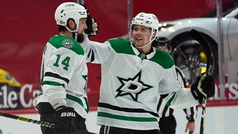 Benn scores in OT, lifts Stars to 2-1 win over Red Wings