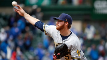Woodruff works 6 innings as Brewers blank Arrieta, Cubs 6-0