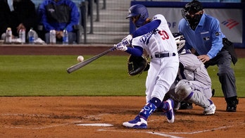 Betts, Bauer star for new fans as Dodgers crush Rockies 7-0