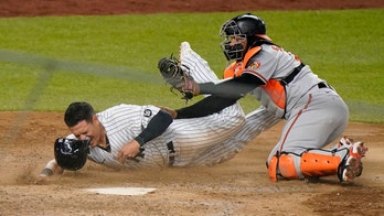 Santander hoses Urshela for last out, O's beat Yanks in 11