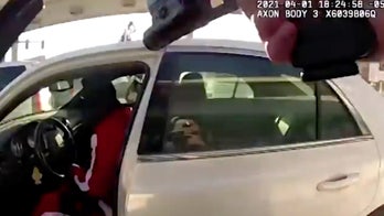 Suspect fatally shot as he dragged Illinois cops at gas station, video shows