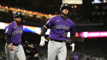 Rockies finally win on the road, beat Giants 7-5 in 10