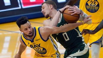 Curry, Warriors use furious finish to hold off Bucks 122-121