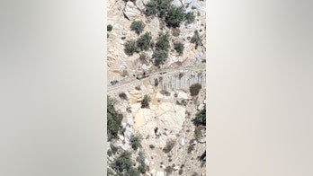 LA mountain biker dangles from side of cliff, is rescued by helicopter