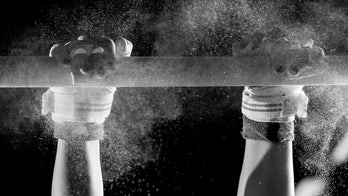 Illinois gymnast celebrates landing with coronavirus vaccination card