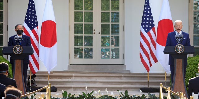 Japan's Prime Minister Yoshihide Suga and U.S. President Joe Biden hold a joint news conference in the Rose Garden at the White House in Washington, U.S., April 16, 2021. REUTERS/Tom Brenner