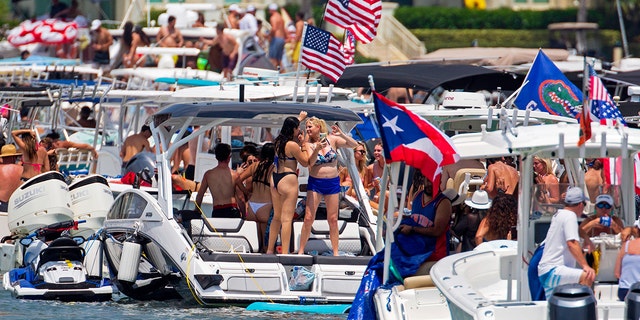 The annual alcohol-fueled Boca Bash attracts thousands of eager boaters, jet skiers, kayakers and paddleboarders to the shallow waters of Lake Boca Raton.