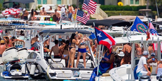 The annual alcohol-fueled Boca Bash attracts thousands of eager boaters, jet skiers, kayakers and paddleboarders to the shallow waters of Lake Boca Raton.