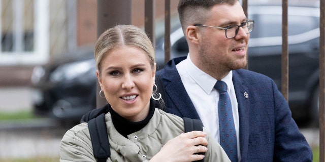 Russian opposition activist Lyubov Sobol and her lawyer Vladimir Voronin arrive at the court in Moscow, Russia, Monday, April 26, 2021. Sobol was detained on Wednesday morning, ahead of a nationwide protest in support of imprisoned Russian opposition leader Alexei Navalny, and charged with violating protest regulations. (AP Photo/Alexander Zemlianichenko)