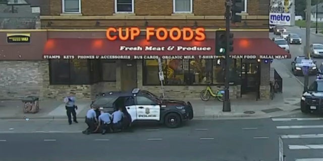 In this image from Minneapolis city surveillance video, Minneapolis police are seen attempting to take George Floyd into custody May 25, 2020, in Minneapolis, Minn.