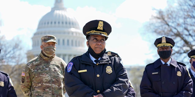 Acting chief of the U.S. Capitol Police Yogananda Pittman listens during a news conference after a car crashed into a barrier on Capitol Hill near the Senate side of the U.S. Capitol in Washington, Friday, April 2, 2021.(AP Photo/Alex Brandon)