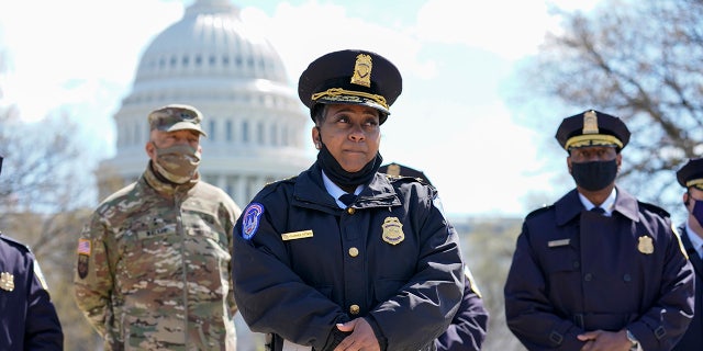 Acting chief of the U.S. Capitol Police Yogananda Pittman listens during a news conference after a car crashed into a barrier on Capitol Hill near the Senate side of the U.S. Capitol in Washington, Friday, April 2, 2021.(AP Photo/Alex Brandon)