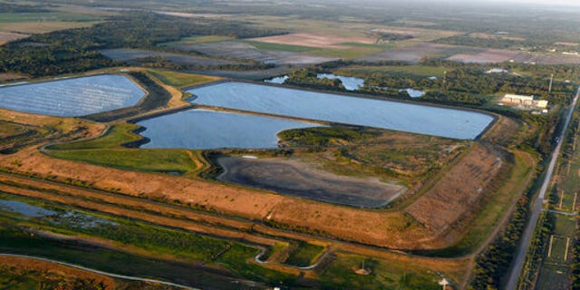 This aerial photo taken from an airplane shows a reservoir near the old Piney Point phosphate mine, Sabato, aprile 3, 2021 in Bradenton, Fla.