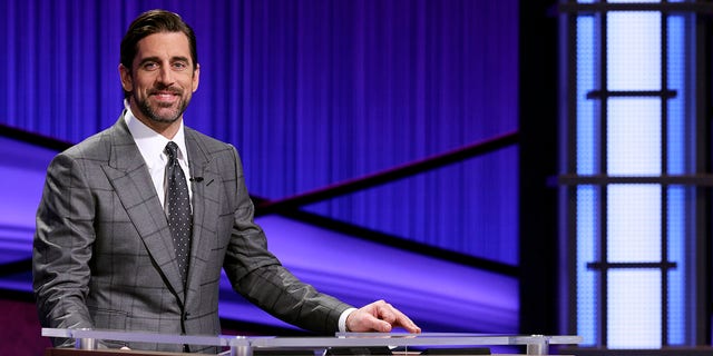 This image released by Jeopardy Productions, 公司. shows Green Bay Packers quarterback Aaron Rodgers as he guest hosts the game show "危险!" Rodgers is hosting the popular game show for the next two weeks as the show goes through a series of guest hosts to replace Alex Trebek, who died of cancer on Nov. 8.