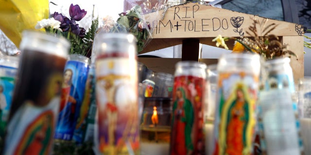 A make shift memorial was made by community members, Tuesday, April 6, 2021, in the memory 13-year-old Adam Toledo, who was shot by a Chicago Police officer at about 2 a.m. on March 29 in an alley west of the 2300 block of South Sawyer Avenue near Farragut Career Academy High School. (AP Photo/Shafkat Anowar)