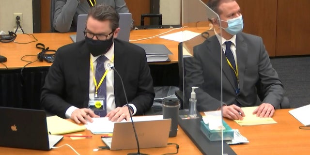 In this image from video, defense attorney Eric Nelson, left, and defendant, former Minneapolis police Officer Derek Chauvin, right, listen as Hennepin County Judge Peter Cahill presides Thursday April 8, 2021, in the trial of Chauvin at the Hennepin County Courthouse in Minneapolis, Minn. (Court TV via AP, Pool)