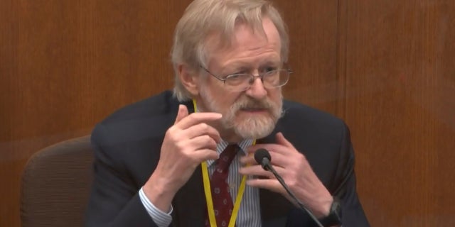 In this image from video, Dr. Martin Tobin testifies as Hennepin County Judge Peter Cahill presides Thursday, April 8, 2021, in the trial of former Minneapolis police Officer Derek Chauvin at the Hennepin County Courthouse in Minneapolis, Minn. Chauvin is charged in the May 25, 2020 death of George Floyd. (Court TV via AP, Pool)