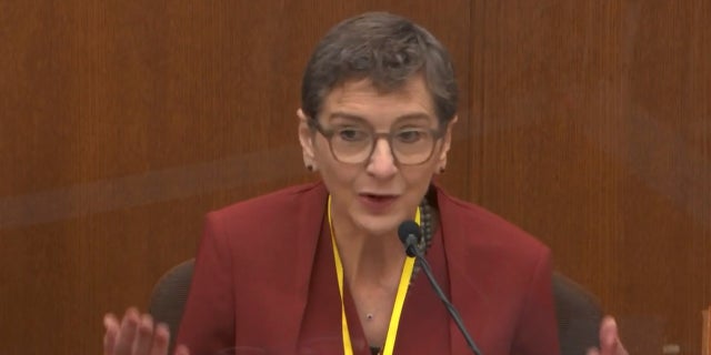 In this image from video, Dr. Lindsey Thomas, a forensic pathologist, now retired, testifies as Hennepin County Judge Peter Cahill presides, Friday, April 9, 2021, in the trial of former Minneapolis police Officer Derek Chauvin at the Hennepin County Courthouse in Minneapolis, Minn. (Court TV via AP, Pool)