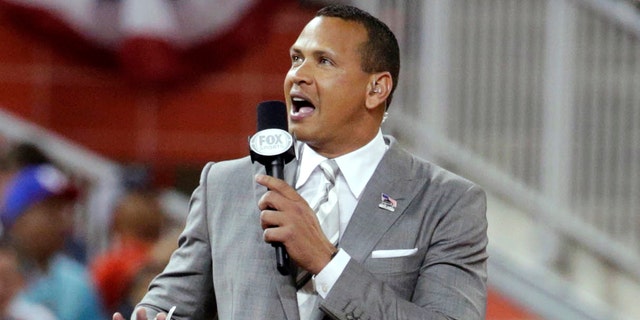 In this July 11, 2017, file photo, former New York Yankee Alex Rodriguez reports from the field during the MLB All-Star Game in Miami. 