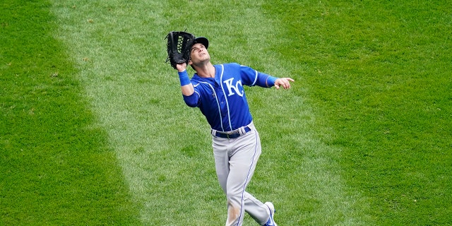 Kansas City Royals left fielder Andrew Benintendi catches the ball of Louis Robert of the Chicago White Sox during the fourth inning of a baseball game in Chicago, Sunday, April 11, 2021. (AP Photo/Nam Y. Huh)
