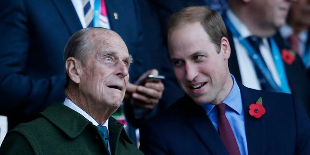 Prince Philip (left) with his grandson Prince William, who is second in line to the British throne.