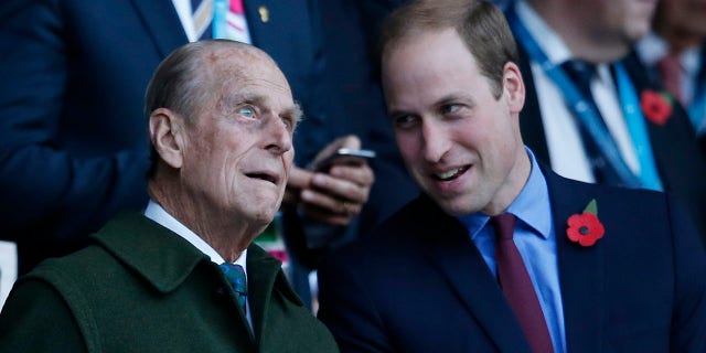 Prince Philip (left) with his grandson Prince William, who is second in line to the British throne.