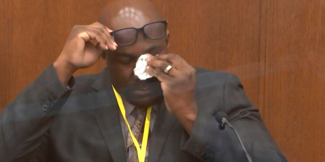 In this image from video, Philonise Floyd, brother of George Floyd, becomes emotional as he testifies as Hennepin County Judge Peter Cahill presides over court Monday, April 12, 2021, in the trial of former Minneapolis police Officer Derek Chauvin, in the May 25, 2020, death of George Floyd at the Hennepin County Courthouse in Minneapolis, Minn. (Court TV via AP, Pool)