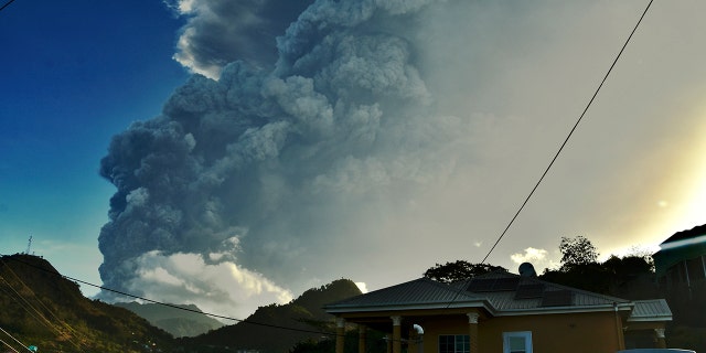 Ash rises into the air as La Soufriere volcano erupts on the eastern Caribbean island of St. Vincent, Tuesday, April 13, 2021. (AP Photo/Orvil Samuel)