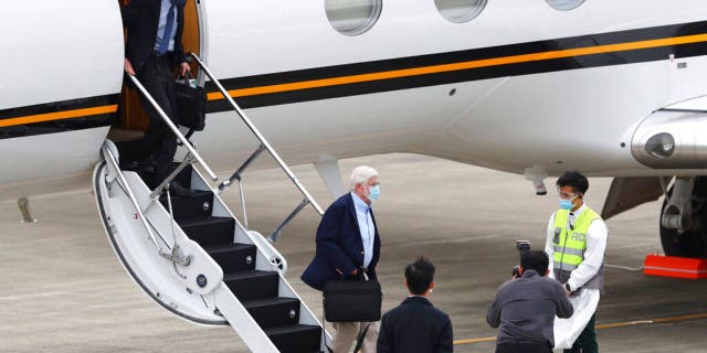 Former U.S. senator Chris Dodd, is followed by former U.S. Deputy Secretary of State James Steinberg as they disembark upon arrival in Taipei, Taiwan on Wednesday, April 14, 2021. (Pool Photo via AP)