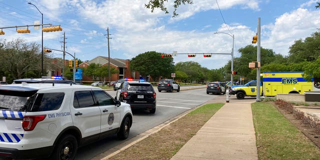 Police and emergency personnel work at the scene of a fatal shooting Sunday in Austin. (AP)