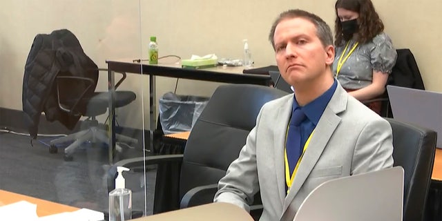 In this image from video, former Minneapolis police Officer Derek Chauvin listens as his defense attorney Eric Nelson gives closing arguments as Hennepin County Judge Peter Cahill preside Monday, April 19, 2021. (Court TV via AP, Pool)